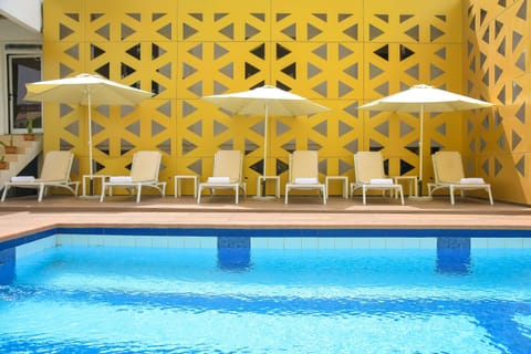 Indoor pool, pool umbrellas, sun loungers