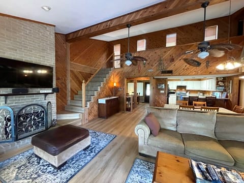 Living room looking into Kitchen and stairs to loft.