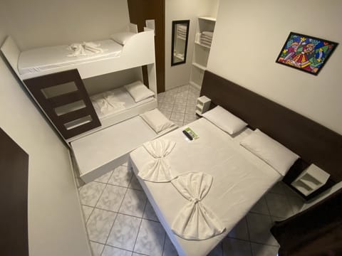 Basic Quadruple Room, 1 Bedroom | Minibar, blackout drapes, free WiFi, bed sheets