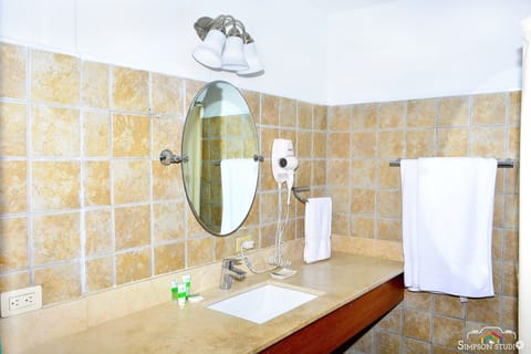 Comfort Quadruple Room, 2 Queen Beds, Non Smoking | Bathroom | Shower, free toiletries, hair dryer, towels