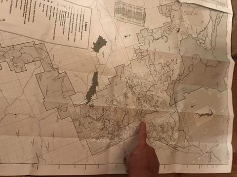 Finger is pointed at Cabin location, note all the trails around cabin to ride