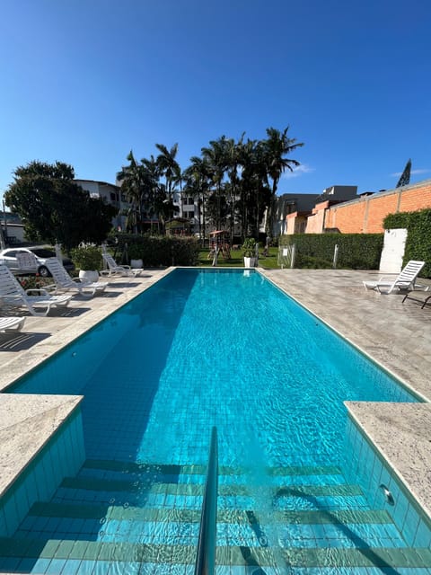 Outdoor pool, open 8:00 AM to 11:00 PM, sun loungers