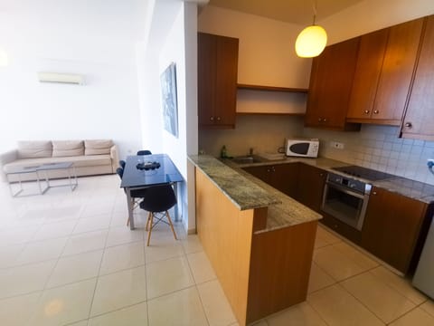 Apartment, 1 Bedroom | Private kitchen | Full-size fridge, oven, stovetop, coffee/tea maker