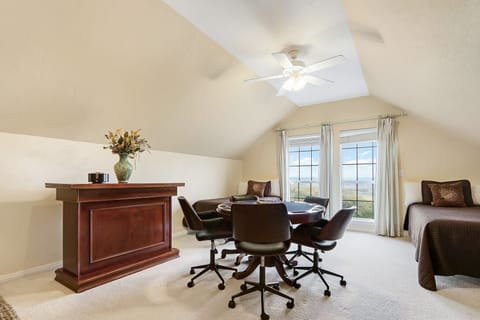 Upstairs Bedroom 3 Game room also has a poker table and bar with seating.