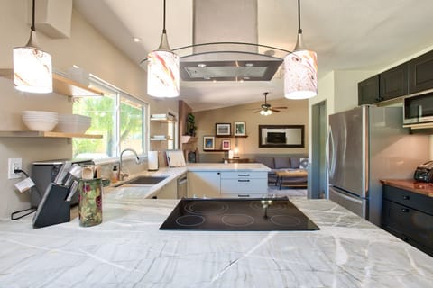 Kitchen has U-shaped layout and some seating at the peninsula in addition to the dining room