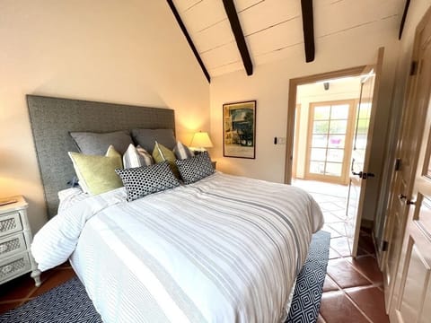 Bedroom #1 with door to attached bathroom. 