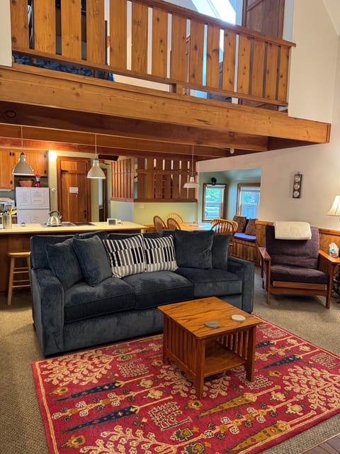 Cozy living room - notice the upstairs loft bedroom above it.