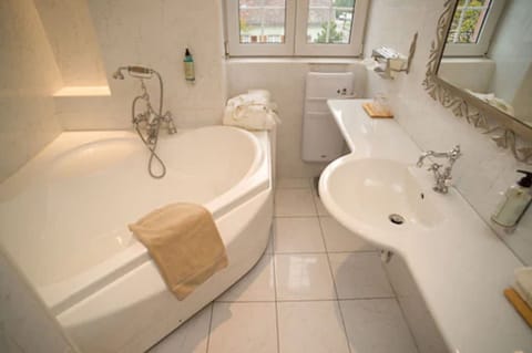 Traditional Suite, Jetted Tub | Bathroom | Free toiletries, hair dryer, towels