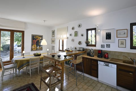 Kitchen, dining area, and french doors onto terrace