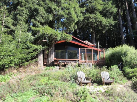 Dining room windows, deck and seating faces the river.