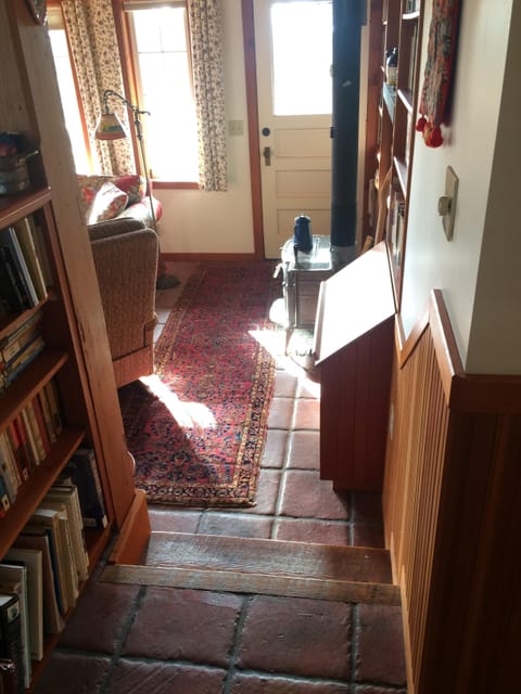 View from kitchen, through living room. Door accessing south facing deck.