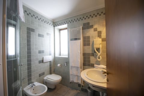 Shower, free toiletries, hair dryer, slippers