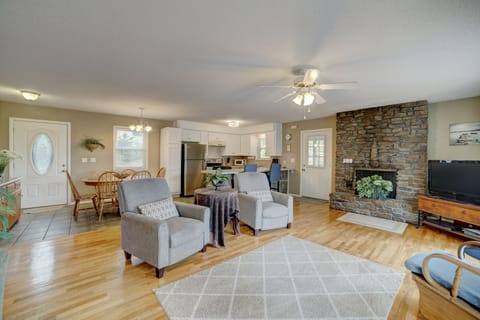 Open floor plan with kitchen, dining, and living room with beautiful lake views