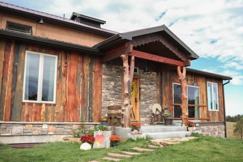 Front of barn/home; level grassed area w/ mood string lights