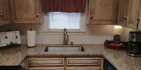 NEW GRANITE AND TILE BACKSPLASH HAVE BEEN ADDED TO OUR KITCHEN