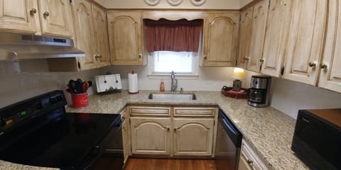 KITCHEN HAS BEEN UPDATED WITH GRANITE AND BACKSPLASH