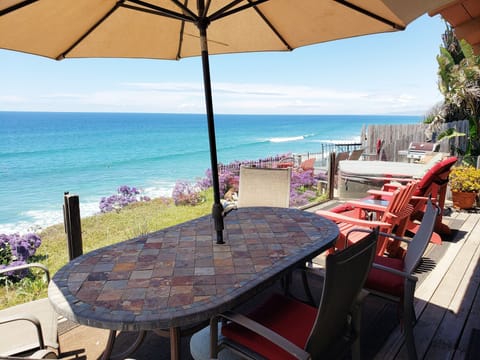 Up on deck, patio below beyond with hot tub