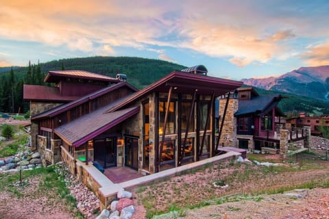 Stunning bird`s-eye view of Pinnacle Lodge, capturing the breathtaking architecture and surrounding mountain views — the perfect luxury getaway.