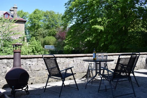 Outdoor seating area offering pleasant views of greenery and gardens