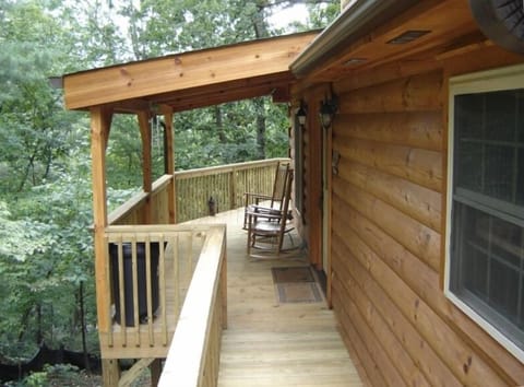 Porch Extends From Driveway to Back Deck