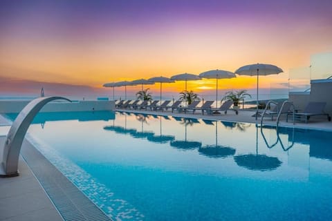 Indoor pool, seasonal outdoor pool, pool umbrellas, sun loungers