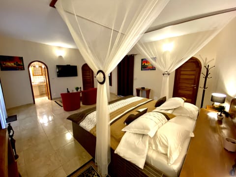 Deluxe Room, 1 King Bed, Non Smoking, Pool View | Minibar, in-room safe, individually decorated, individually furnished
