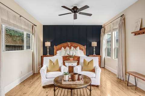 King bed is made up with high thread count soft linens, quilt, feather duvet, down and down alternate pillows.