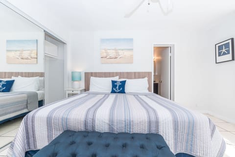 Bedroom #3 includes a king bed, TV, and en suite bathroom.
                