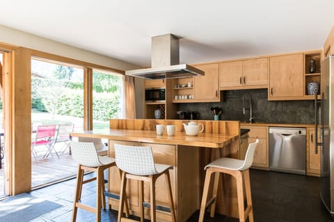 Fully equipped kitchen with island and bar stools