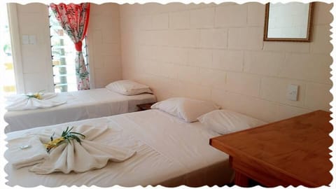 Basic Triple Room, Shared Bathroom | Individually furnished, desk, WiFi, bed sheets