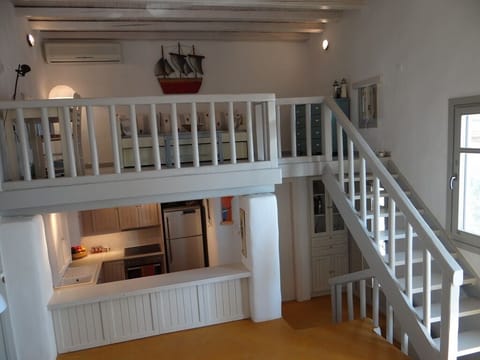 view of loft and kitchen from living room