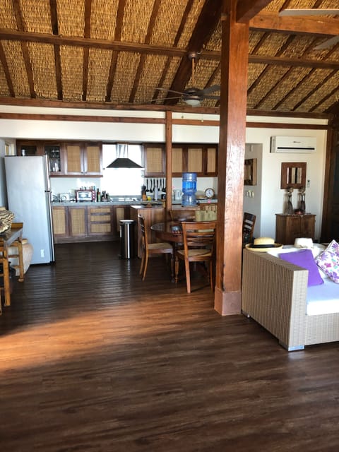 View of living, inside dinning table and kitchen