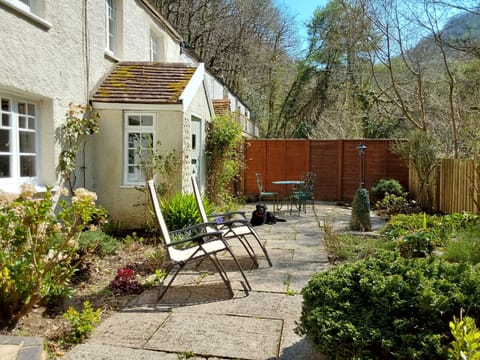 The front garden with plenty of seating and deckchairs provided