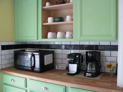 Coffee and tea provided in the cupboard above the coffee maker and Keurig
