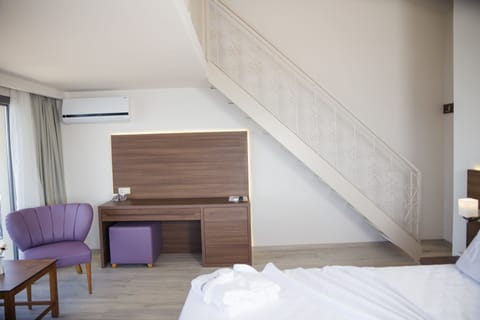 Family Room, Partial Sea View | Premium bedding, minibar, in-room safe, desk