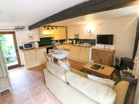 Kitchen has oven, hob, grill, fridge, freezer, dishwasher & microwave.