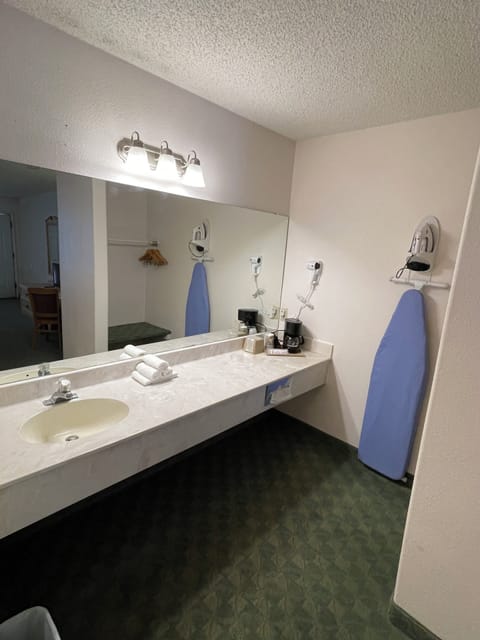 Combined shower/tub, hair dryer, towels, soap