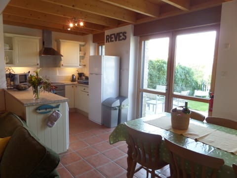 Fully equipped kitchen opening onto terrace/garden