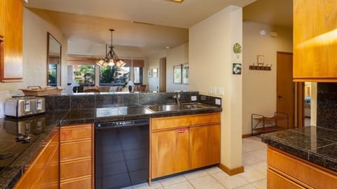 Full kitchen with granite counters and modern appliances