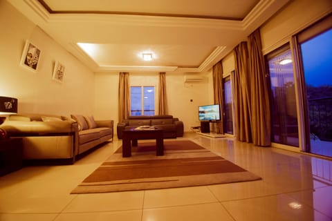 Executive Apartment, 3 Bedrooms, Golf View | Living area | 63-inch flat-screen TV with satellite channels, TV, DVD player