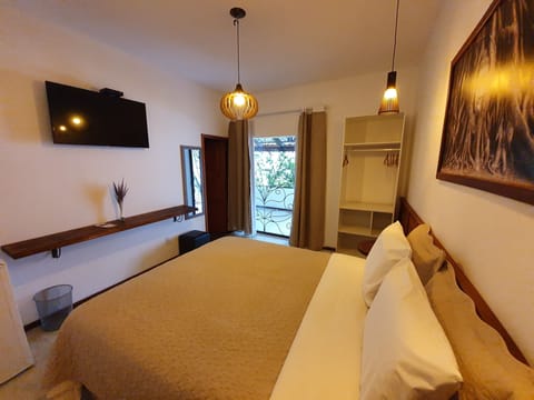 Twin Room, 1 Queen Bed, Garden View | Minibar, blackout drapes, free WiFi, bed sheets