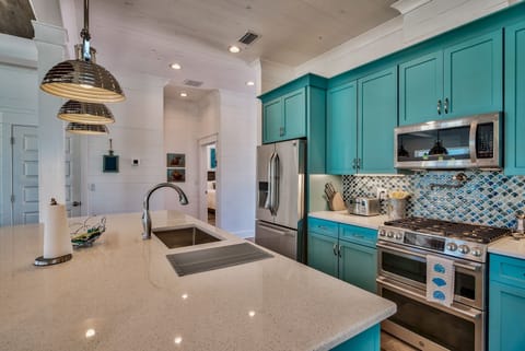 6-burner gas range, ice maker, trash compactor, Keurig and Ninja brew station