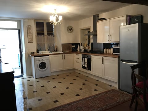Kitchen with gas hob oven microwave and washing machine 