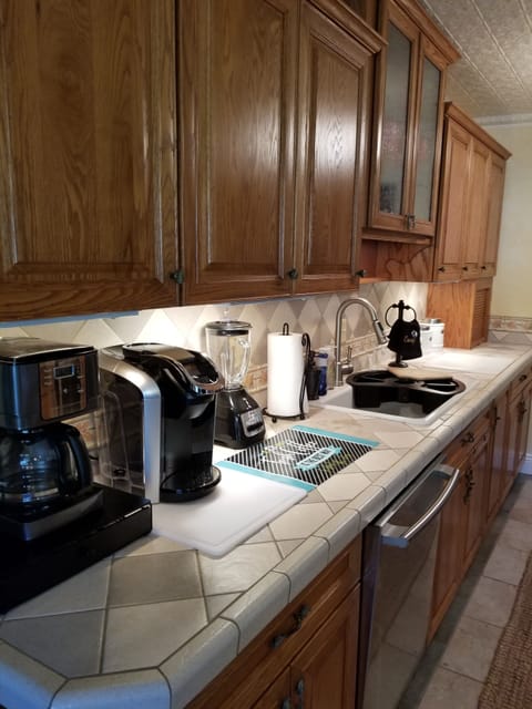 Fully accessorized spacious galley kitchen, SS appliances, microwave, dishwasher