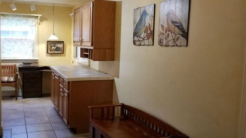 More tiled wet area leads to our Utility area with Washer/Dryer and room to fold