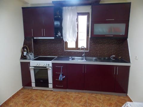 Apartment, 2 Bedrooms | Private kitchen | Fridge, stovetop, electric kettle, cookware/dishes/utensils