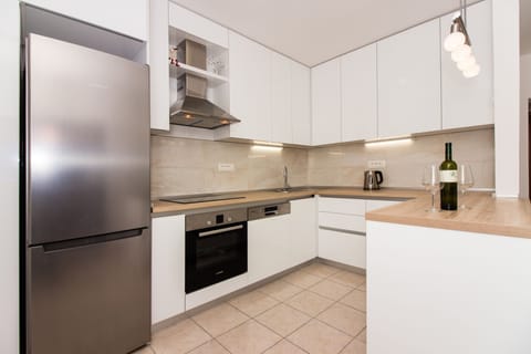 Family Apartment, Courtyard View | Private kitchen | Full-size fridge, oven, stovetop, dishwasher