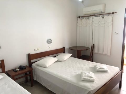 Economy Room | In-room safe, blackout drapes, free WiFi, bed sheets