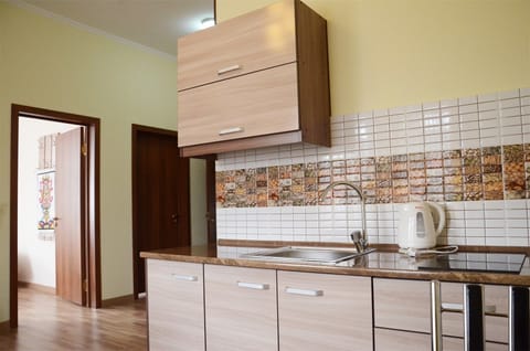 Family Room | Private kitchenette | Fridge, electric kettle