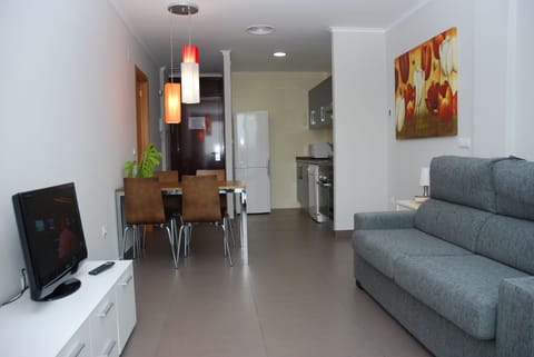 Apartment, 1 Bedroom, Sea View | Living room | Flat-screen TV